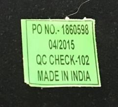 Green sticker affixed to the back of the mirror